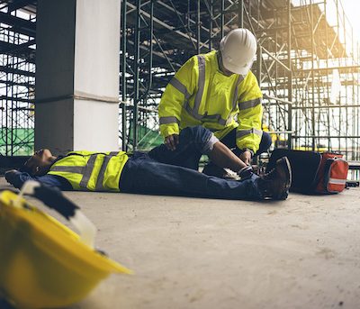 First aid support accident in site work, Builder accident fall scaffolding to the floor, Safety team help employee accident.